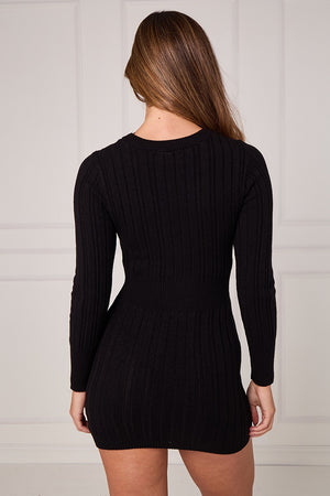 Black cable knit mini dress with long sleeves and back ribbed texture