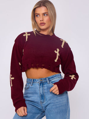 Wine red knitted crop jumper with gold crucifix motifs, long sleeves, ribbed cuffs