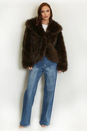 Full-length view of the dark brown shaggy fur coat worn open