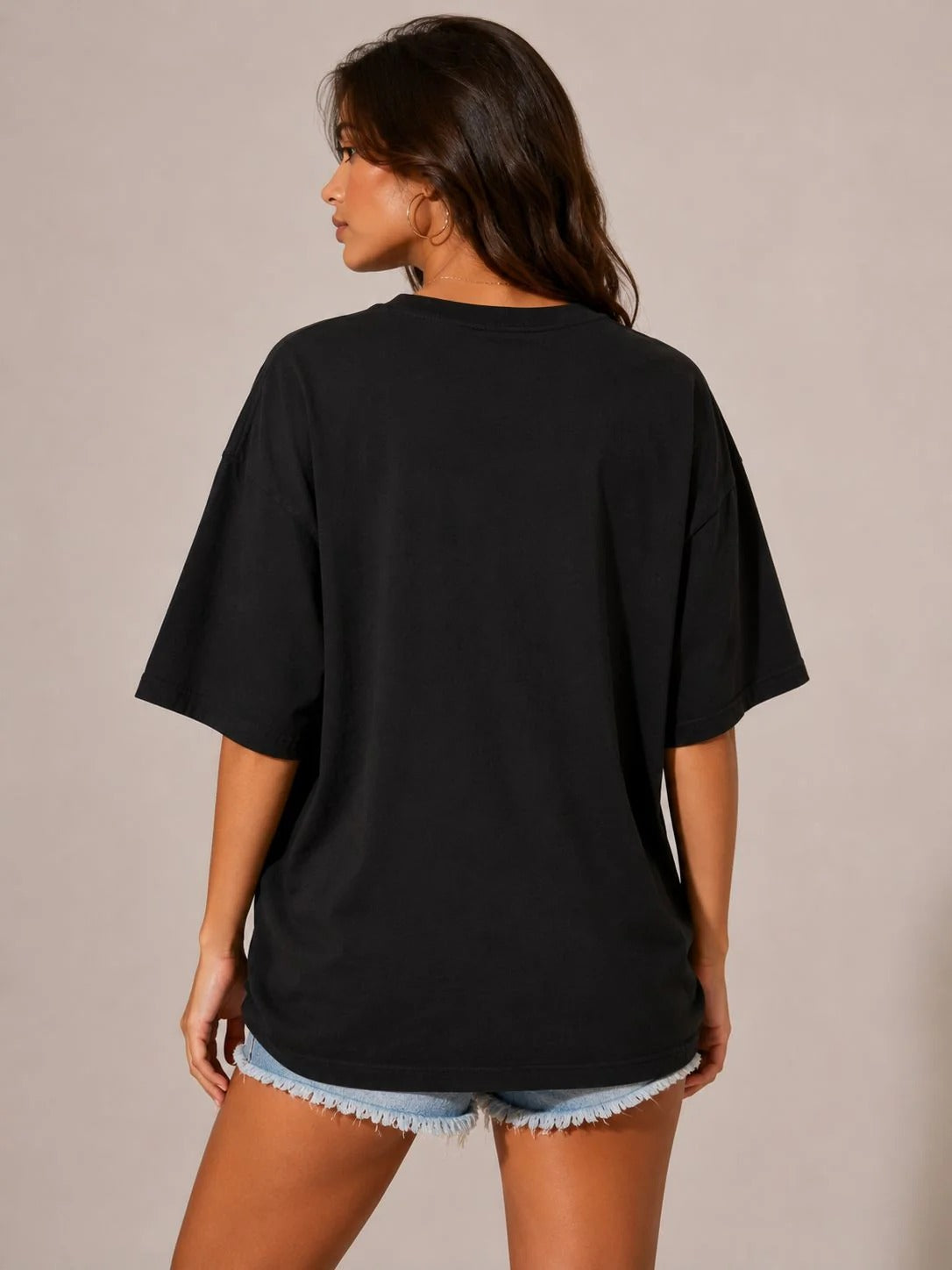 Women's black T-shirt, back view with loose fit and crew neckline
