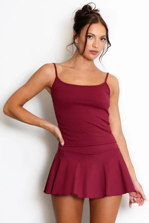 Wine cami gym top with spaghetti straps and peplum hem, fitted bodice