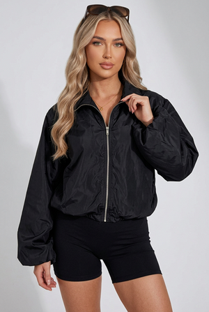 Black windbreaker jacket with front zipper, stand collar, and elastic cuffs