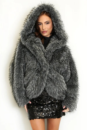 Grey shaggy fur coat with oversized hood and long sleeves, worn closed