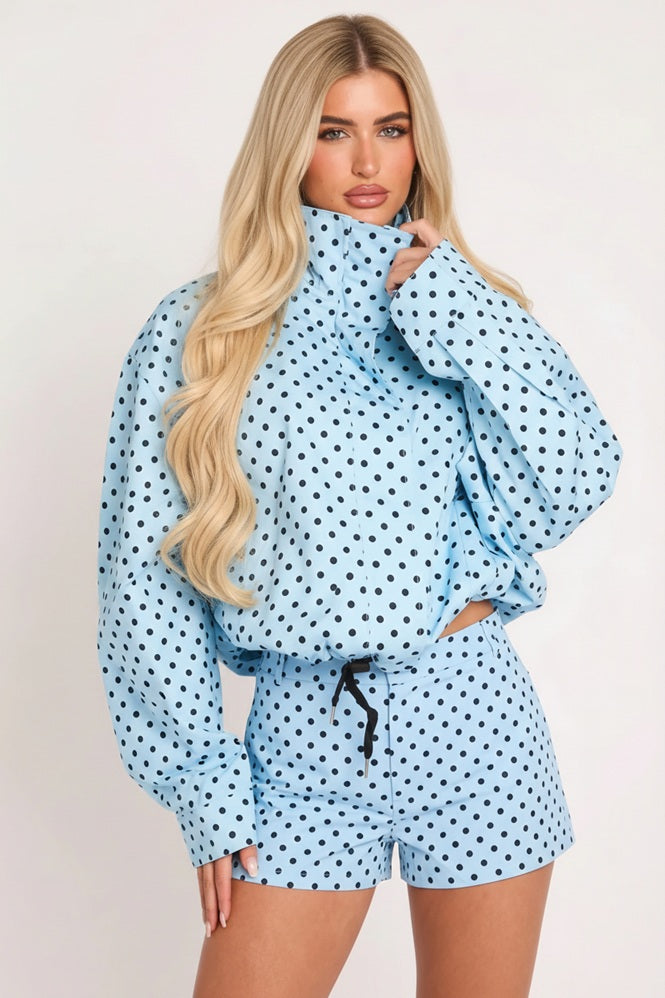 Powder blue polka dot zip-up jacket with stand collar and drawstring waist