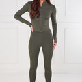 Olive green zip-front active top and high-rise leggings set