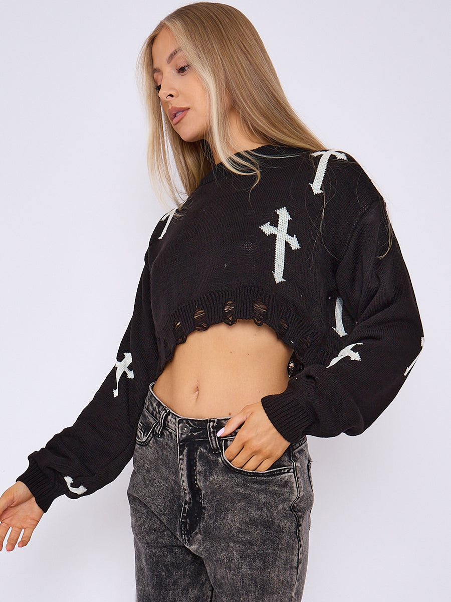 Black knitted crop jumper with white crucifix print, cutout ribbed hem and long sleeves
