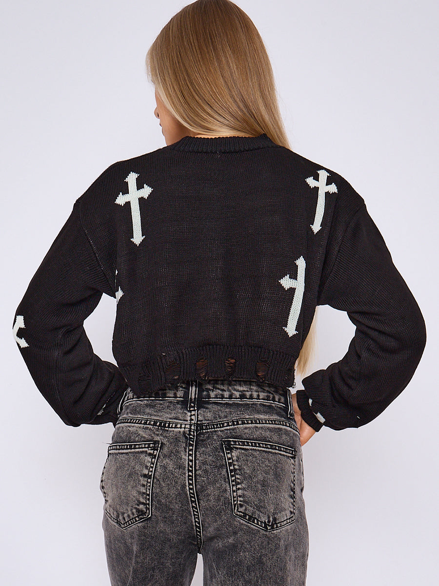Black knitted crop jumper shown from back with white cross print and frayed hem