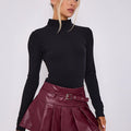 Wine faux-leather pleated skort with belt, front view