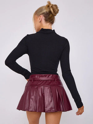 Wine faux-leather skort, back view showing waistband and pleats