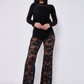 Black lace flared trousers with high waist and wide bell-leg silhouette