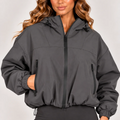 Grey hooded zip-up windbreaker jacket front view with zip pockets and elastic cuffs