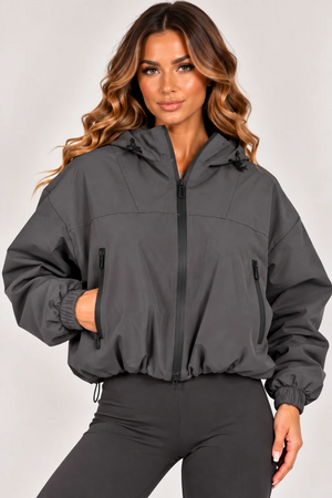 Grey hooded zip-up windbreaker jacket front view with zip pockets and elastic cuffs