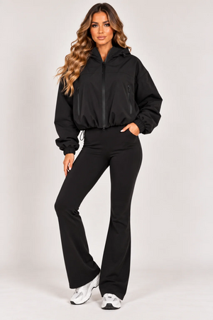 Black hooded zip-up windbreaker jacket with drawstring waist and zip side pockets