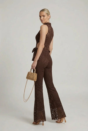 Brown lace halter jumpsuit with cut-out back and flared bell legs, satin bow at waist