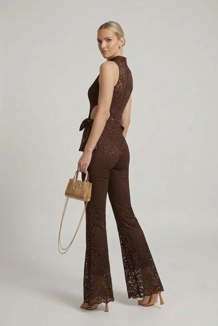 Brown lace halter jumpsuit with cut-out back and flared bell legs, satin bow at waist
