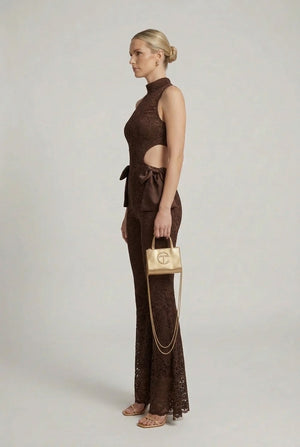 Brown lace halter jumpsuit with cut-out back, flared bell legs and waist bow detail