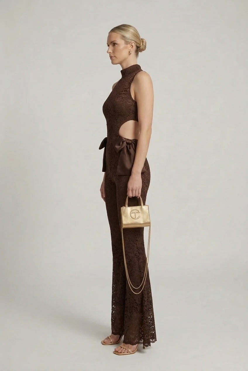 Brown lace halter jumpsuit with cut-out back, flared bell legs and waist bow detail