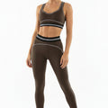 Brown striped crop top and leggings gym set with black-and-white waistband