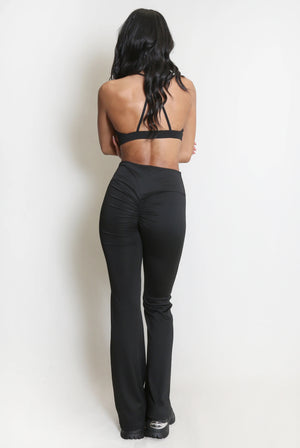 Ruched push-up flare trousers, black, back view with gathered side ruching