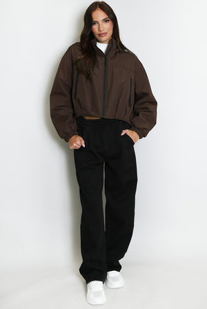 Brown cropped hooded jacket with front zipper and elastic cuffs