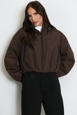 Brown cropped hooded jacket with zip front and side pocket openings
