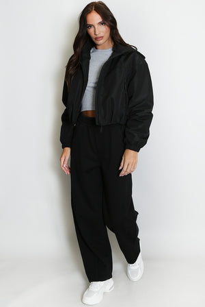 Black cropped hooded jacket with full-length sleeves and front zipper