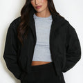 Black cropped hooded jacket with front zipper and hood