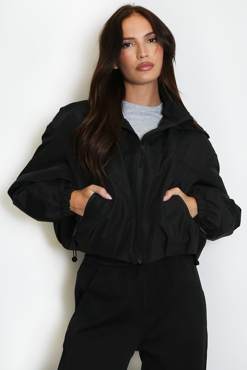 Black cropped hooded jacket with zip front and drawstring hood