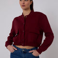 Burgundy cropped fleece bomber jacket with button front and flap pockets