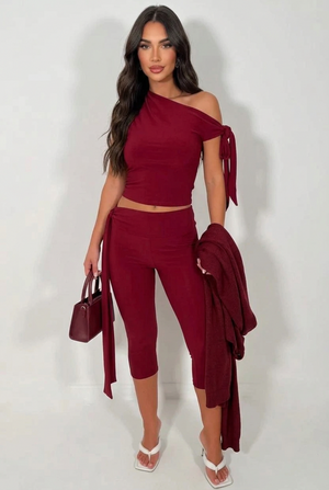 Wine two-piece set with an asymmetric tie-shoulder top and cropped tie-waist leggings