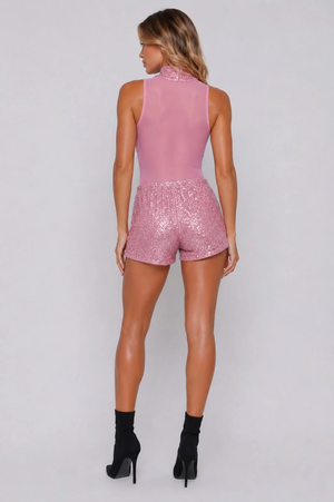 Pink sequin mesh high-neck bodysuit with matching sparkly shorts, back view