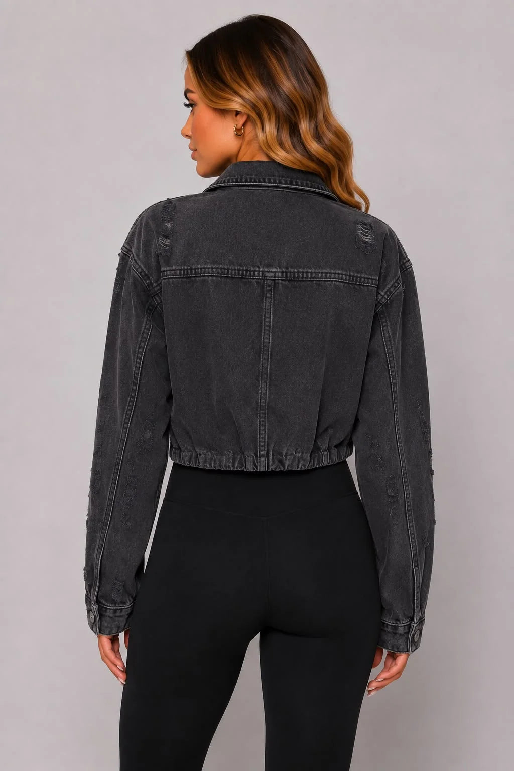 Dark gray cropped distressed denim jacket back view with two button panels