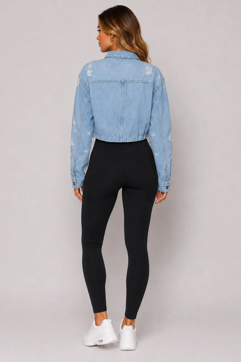 Light blue cropped distressed denim jacket back view with button detailing
