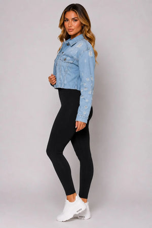 Light blue cropped distressed denim jacket side view with button front and long sleeves