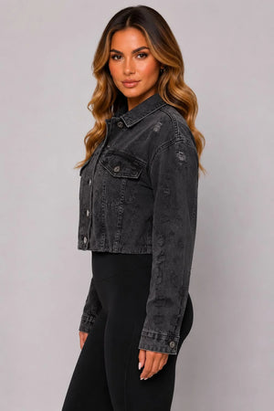Dark gray cropped distressed denim jacket with button closure and long sleeves