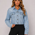Light blue cropped distressed denim jacket with button front and flap chest pockets