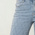 Light blue wide fit denim jeans with diamond rhinestone pattern and front pocket detail