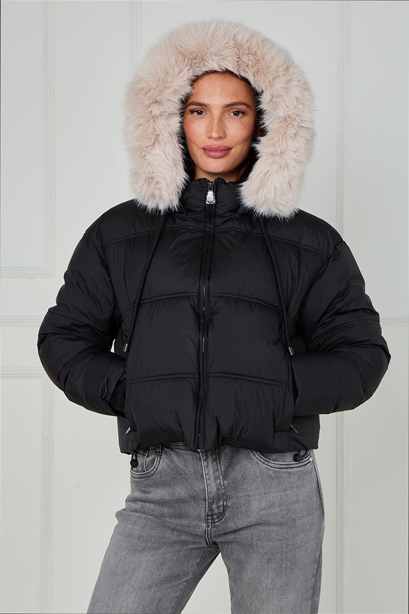 Black faux fur hood puffer jacket, hood up, front full-zip with quilted panels