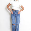 Blue ripped dad-fit denim jeans with distressed knees and button fly