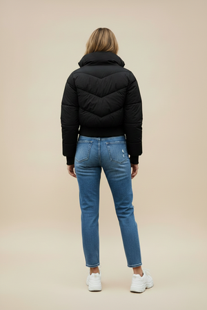 Black quilted puffer jacket with hood; rear view shows quilted back panel.