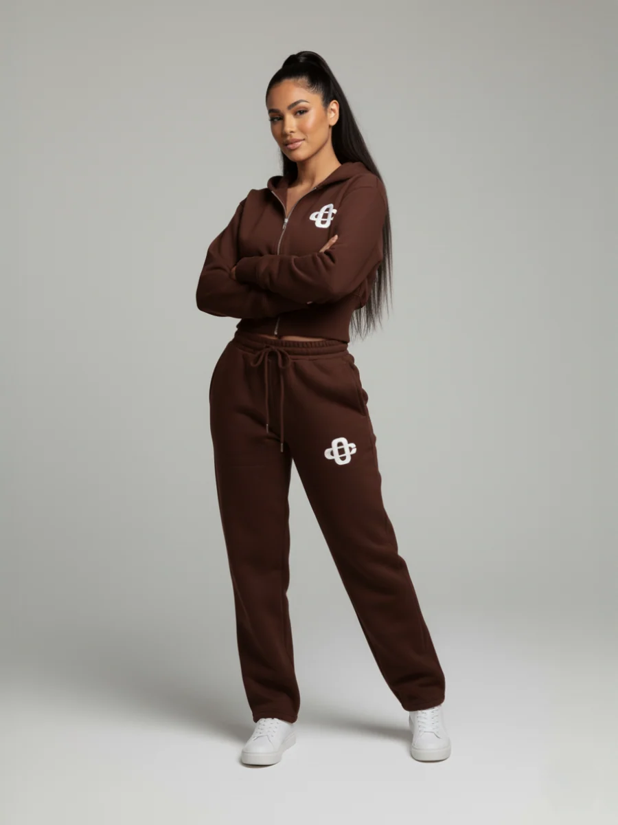Brown cropped zip hoodie and jogger set with drawstring waist and front logo