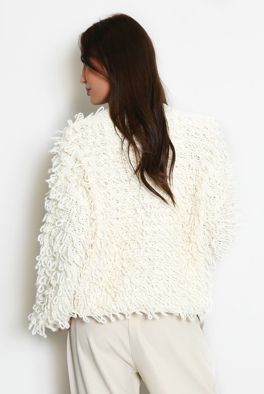 Cream loop-knit cardigan with shaggy loop texture, long sleeves, back view