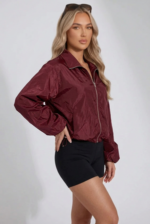 Wine windbreaker jacket with front zipper, stand collar, and relaxed sleeves