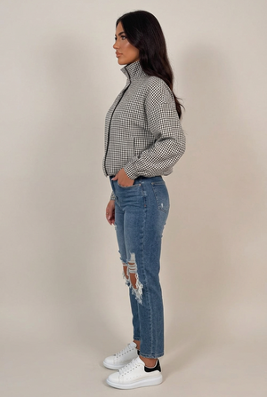 Black and white check jacket with stand collar and long sleeves, side view