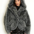 Grey shaggy fur coat with oversized hood and long sleeves, worn closed