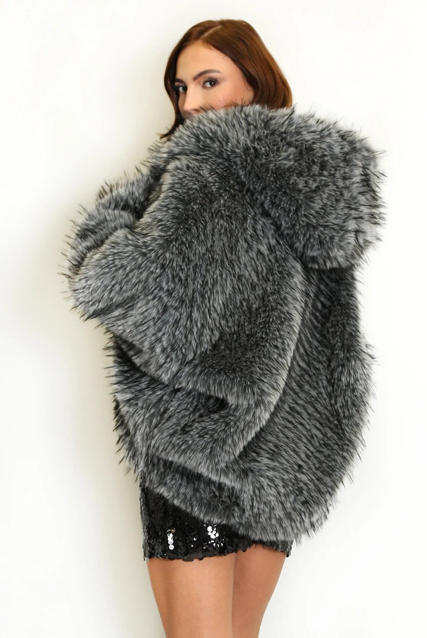 Back and side view of the grey shaggy fur coat with its oversized hood