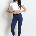 High-waisted sports leggings in dark navy, full-length, sleek fitted design