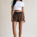 Brown contrast-waist runner shorts with elastic waistband and side pockets